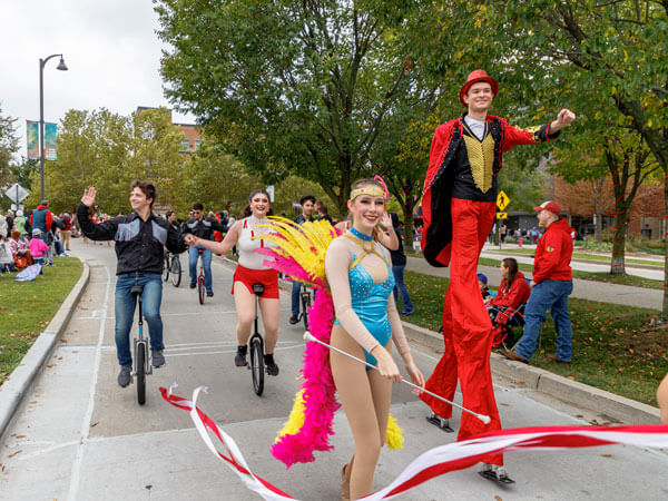Gamma Phi Circus members perform during the homecoming parade.